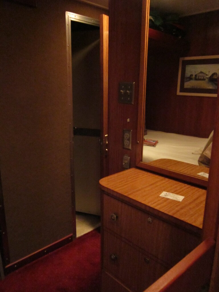 The interior of a sleeper car bedroom.