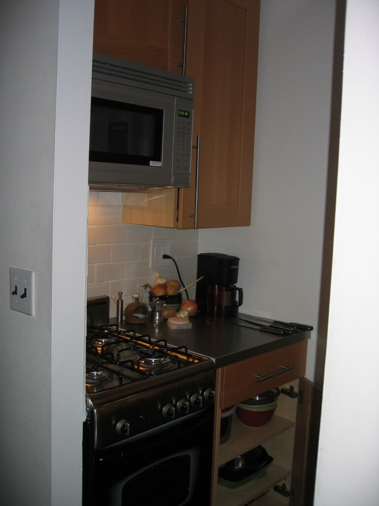 Here is the best shot I could manage of one side of my 24 square foot kitchen after its renovation. The other side has a large bar sink and an under counter fridge, as well as cabinetry overhead. 2009.