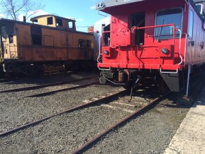 A Maine Central caboose and a Canadian National "van" sit in the yard at Danbury Railway Museum. RL Fifield 2015.